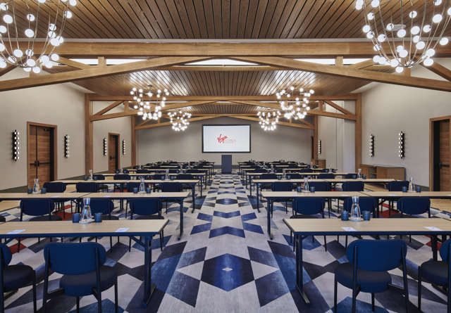 The Great Room event venue at Virgin Hotels Nashville with sleek design and a large space setup in a classroom style.
