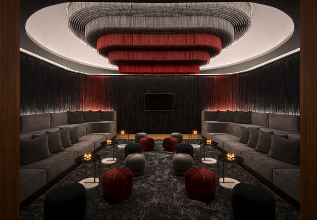Commons Club Shag Room inside Virgin Hotels Nashville with cozy seating and vibrant decor.
