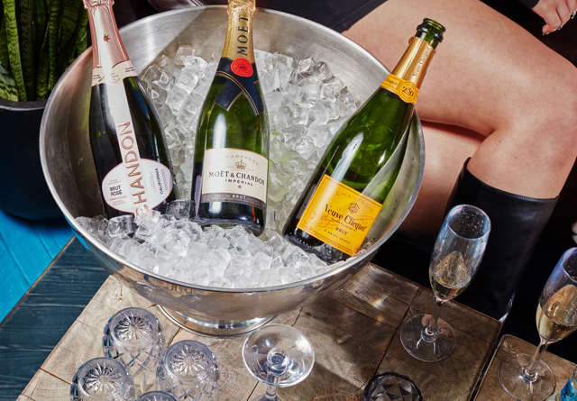Ice bucket with refreshments at Virgin Hotels Chicago rooftop bar.